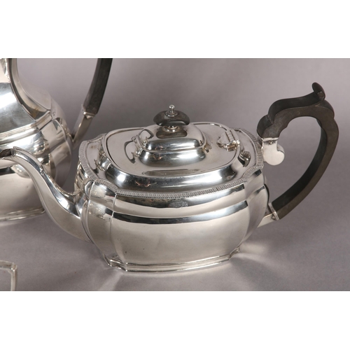 246 - A GEORGE V SILVER FOUR PIECE TEA AND COFFEE SERVICE of oblong baluster outline with egg and dart rim... 