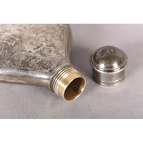 253 - A VICTORIAN SILVER SPIRIT FLASK, of oval outline with foliate scroll engraving and open quatrefoil c... 