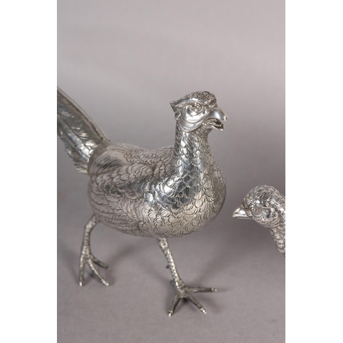 264 - A PAIR OF PHEASANTS NATURALISTICALLY MODELLED IN .835 DUTCH SILVER, c.1920, each approximate 40cm lo... 