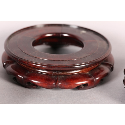 168B - FOUR GOOD QUALITY CHINESE CARVED AND PIERCED ROSEWOOD VASE STANDS, circular, each 20cm diameter