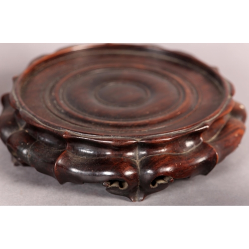 168B - FOUR GOOD QUALITY CHINESE CARVED AND PIERCED ROSEWOOD VASE STANDS, circular, each 20cm diameter