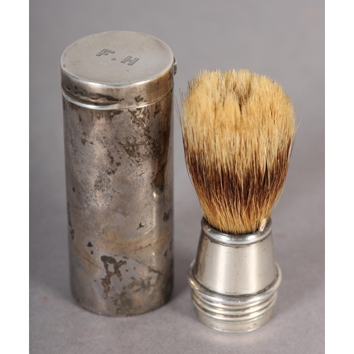 281 - A GEORGE V SILVER CASED TRAVELLING SHAVING BRUSH, of cylindrical outline with hinged lid initialled ... 