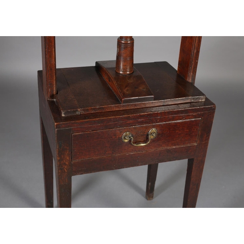 466 - A LATE 18TH CENTURY MAHOGANY BOOK PRESS, the stand having a frieze drawer with braSs handle, on squa... 