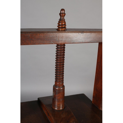 466 - A LATE 18TH CENTURY MAHOGANY BOOK PRESS, the stand having a frieze drawer with braSs handle, on squa... 