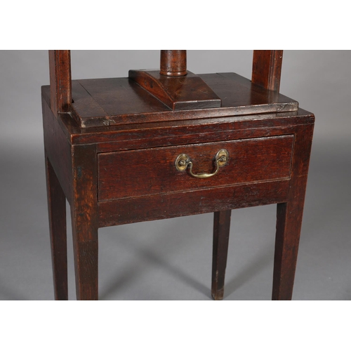 466 - A LATE 18TH CENTURY MAHOGANY BOOK PRESS, the stand having a frieze drawer with braSs handle, on squa... 