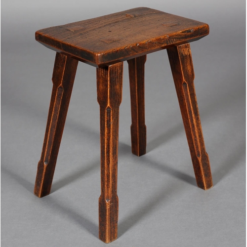 468 - A LATE 18TH CENTURY ELM STOOL, rectangular, with fruitwood joint pegs, on square tapered and chamfer... 