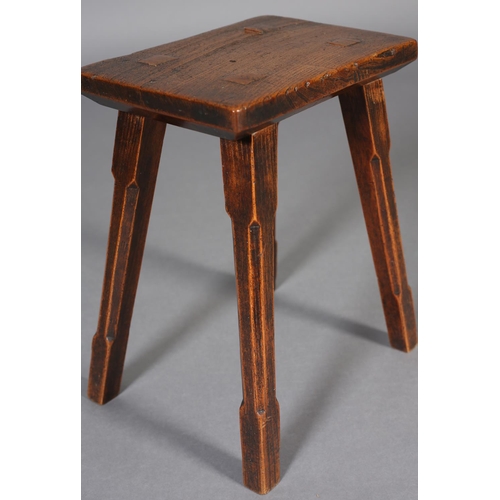 468 - A LATE 18TH CENTURY ELM STOOL, rectangular, with fruitwood joint pegs, on square tapered and chamfer... 