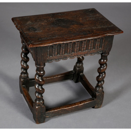 469 - AN EARLY 18TH CENTURY STYLE OAK JOYNT STOOL, the seat with moulded edge above an arcaded apron, on b... 