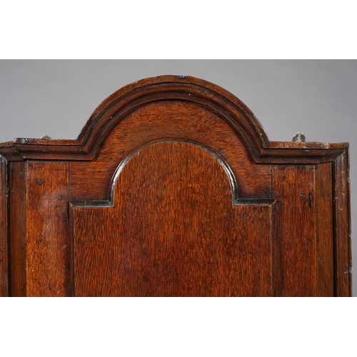 472 - A MID 18TH CENTURY OAK HANGING CORNER CUPBOARD, of arched profile with moulded cornice and sides, ab... 