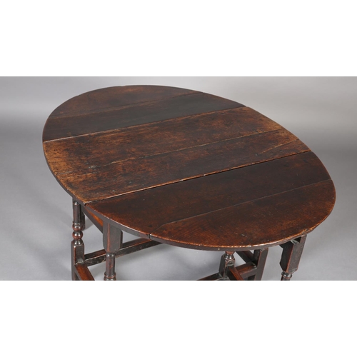 470 - A MID 18TH CENTURY OAK GATELEG TABLE, having twin oval drop leaves, on turned and square framing, 12... 