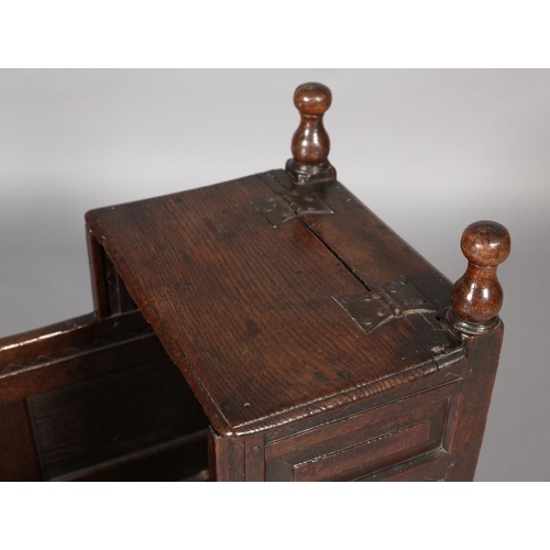 471 - A MID 18TH CENTURY OAK CRADLE, having a square canopy with hinged top, field panelled to all sides, ... 