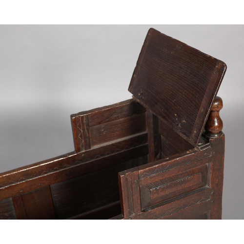 471 - A MID 18TH CENTURY OAK CRADLE, having a square canopy with hinged top, field panelled to all sides, ... 