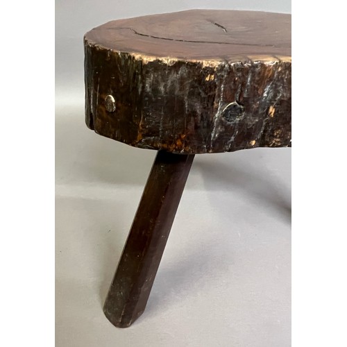 92B - AN EARLY 19TH CENTURY YEW-WOOD STOOL, the seat rough cut from the tree, the surface polished, on thr... 