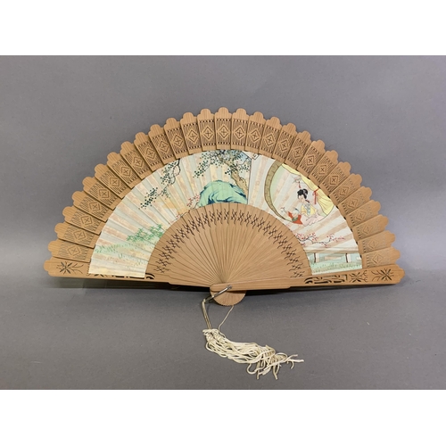 139 - An early 19th century Chinese folding fan, the monture of wood, the head quite bulbous, the guards p... 