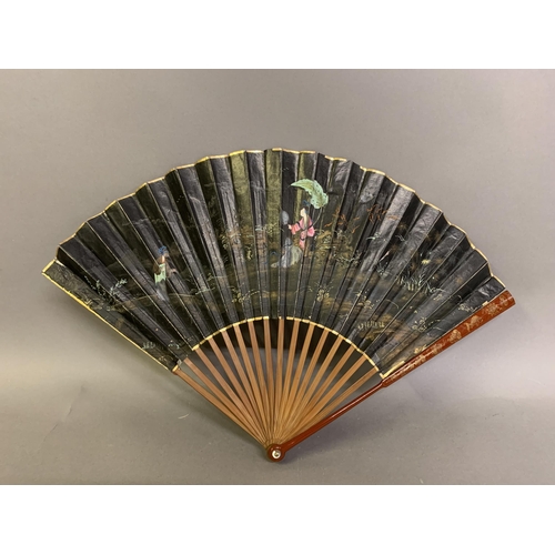 139 - An early 19th century Chinese folding fan, the monture of wood, the head quite bulbous, the guards p... 