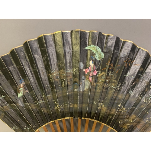 139 - An early 19th century Chinese folding fan, the monture of wood, the head quite bulbous, the guards p... 