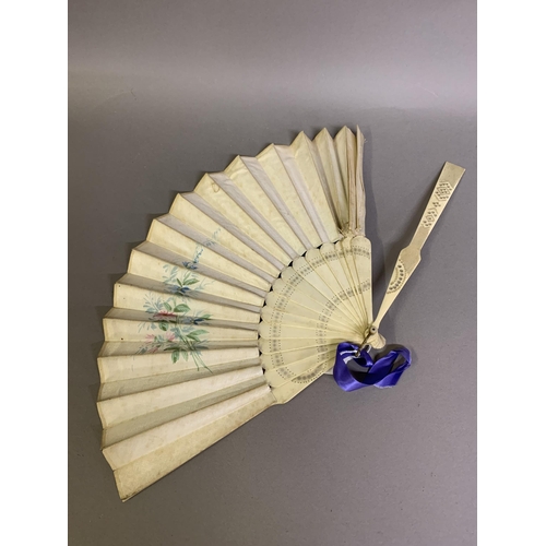 35 - A c 1890’s topographical fan, the plain bone monture mounted with a silk leaf in turquoise blue, pai... 