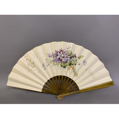 30 - A dated, painted paper fan, bearing initials for BC, the date of 1906 and a spray of violets to the ... 