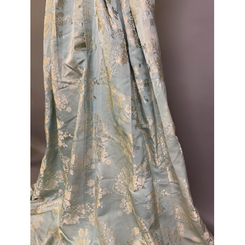 222 - A silk gown bearing the woven waist label of Eliza Pultz, 27 Dover Street, London, the aqua silk wov... 