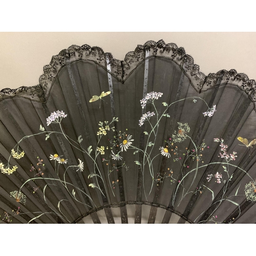 12 - Three large c 1890’s fans, all on black wood, the first with a deep border of painted butterflies, f... 