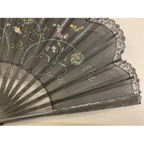 12 - Three large c 1890’s fans, all on black wood, the first with a deep border of painted butterflies, f... 