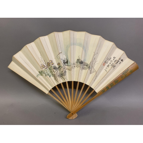 142 - Twentieth century Chinese and Japanese fans: a large folding paper fan, the plain wood sticks with w... 