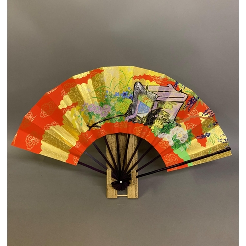 142 - Twentieth century Chinese and Japanese fans: a large folding paper fan, the plain wood sticks with w... 