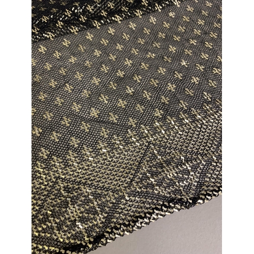 276 - 1920’s, a wide black azute or assuit shawl, the pressed silver decoration in stylized, geometric des... 