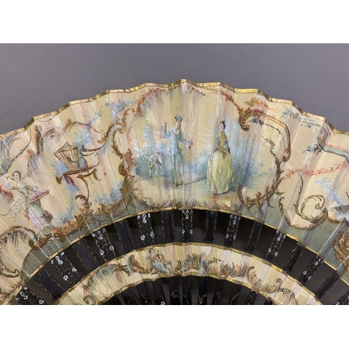 41 - A large late 19th century wood fan, the guards shaped and painted, the leaf mounted in cabriolet fas... 