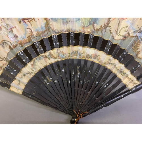 41 - A large late 19th century wood fan, the guards shaped and painted, the leaf mounted in cabriolet fas... 