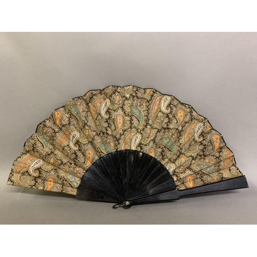 39 - Three fans, the first late 19th century, wood sticks painted black and mounted with a fabric leaf of... 