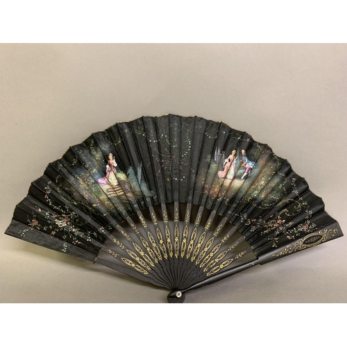 39 - Three fans, the first late 19th century, wood sticks painted black and mounted with a fabric leaf of... 