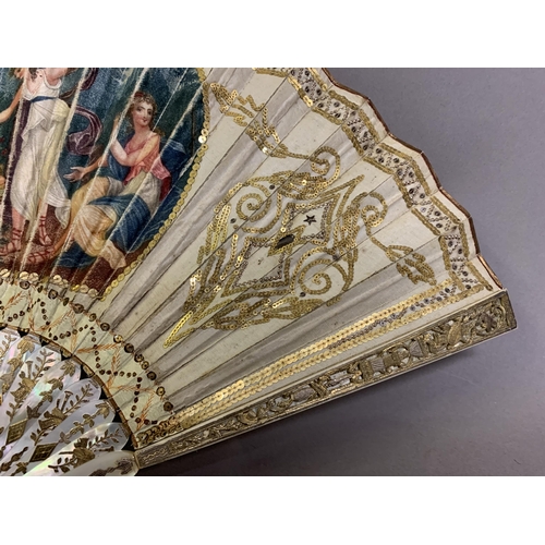 18 - A Regency period white mother of pearl fan, the monture decoratively gilded, the upper guards carved... 