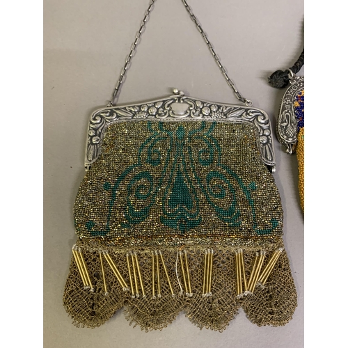 272 - A large c 1900 beaded bag with a design to both panels of a peacock seated on a branch with blossoms... 