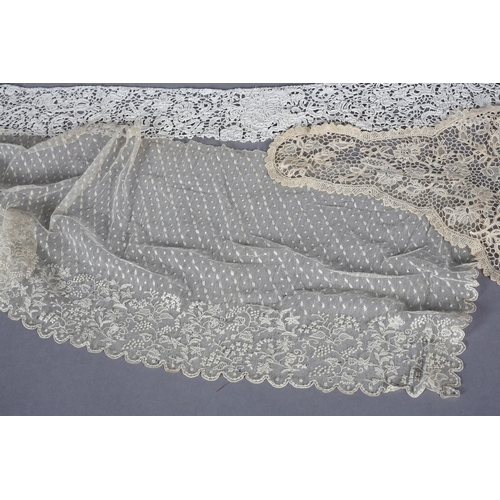 200 - Antique Lace: An unused Youghal needle lace cap with side lappets, designed with meandering flowers ... 