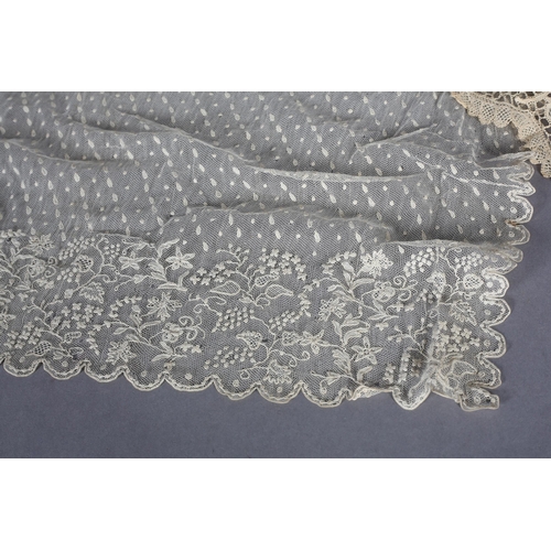 200 - Antique Lace: An unused Youghal needle lace cap with side lappets, designed with meandering flowers ... 