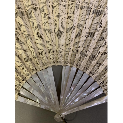 83 - Maltese Lace: a large and showy white mother of pearl fan mounted with a deep handmade Maltese lace ... 