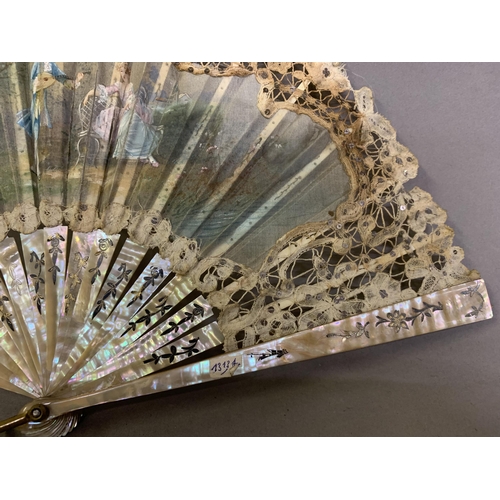 84 - An early 20th century Brussels tape lace fan with central painted gauze depiction of a courting coup... 