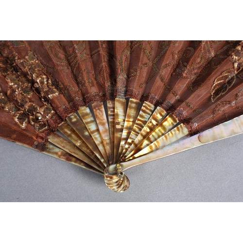 54 - A Belle Epoque fan of ballon form, the shaped monture of shaded mother of pearl, the gorge sticks dy... 