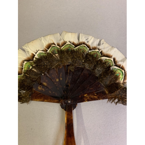 110 - Two small 19th century marquetry feather fans of the type using game feathers, both faux tortoiseshe... 