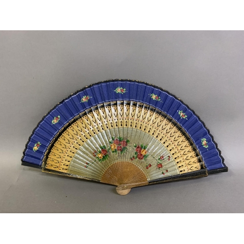 58 - A good, large  c 1890’s bone fan, mounted with a deep silk leaf, painted with an informal gathering ... 