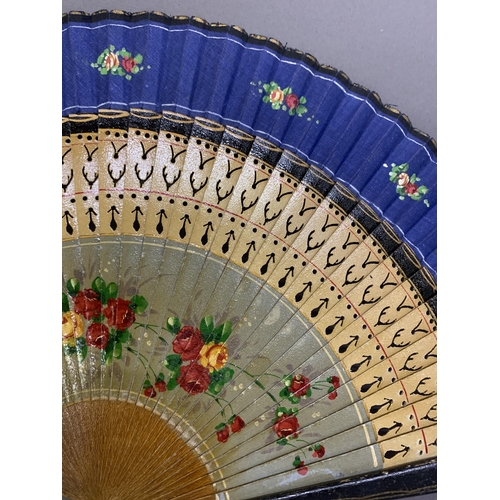 58 - A good, large  c 1890’s bone fan, mounted with a deep silk leaf, painted with an informal gathering ... 