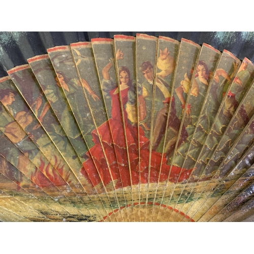 58 - A good, large  c 1890’s bone fan, mounted with a deep silk leaf, painted with an informal gathering ... 