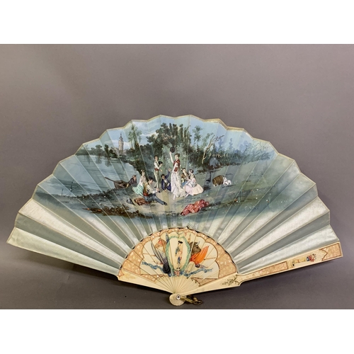 58 - A good, large  c 1890’s bone fan, mounted with a deep silk leaf, painted with an informal gathering ... 