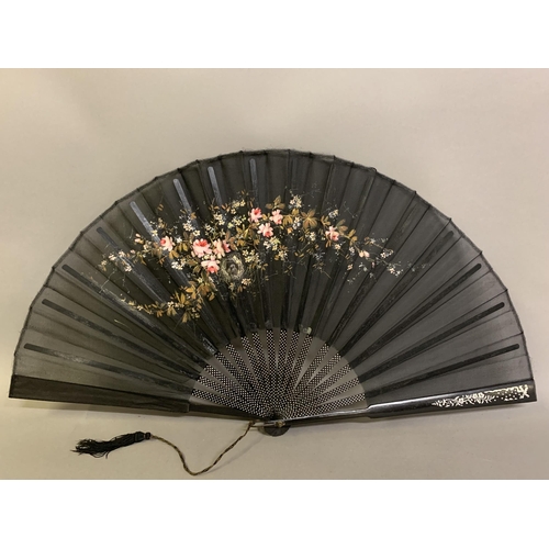 59 - c.1890’s, a large pink mother of pearl fan, the leaf of black lace mounted à l’anglaise, shaped head... 