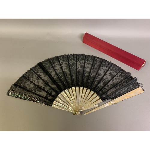 59 - c.1890’s, a large pink mother of pearl fan, the leaf of black lace mounted à l’anglaise, shaped head... 