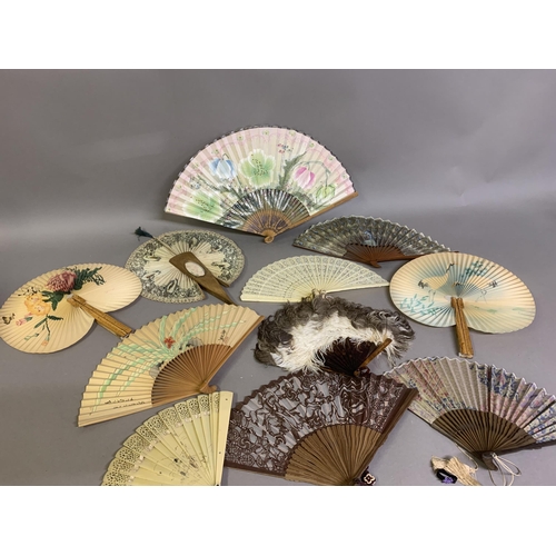 60 - A small 20th century celluloid brisé fan with a faint design of dancers, the lower guard printed wit... 