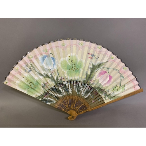 60 - A small 20th century celluloid brisé fan with a faint design of dancers, the lower guard printed wit... 