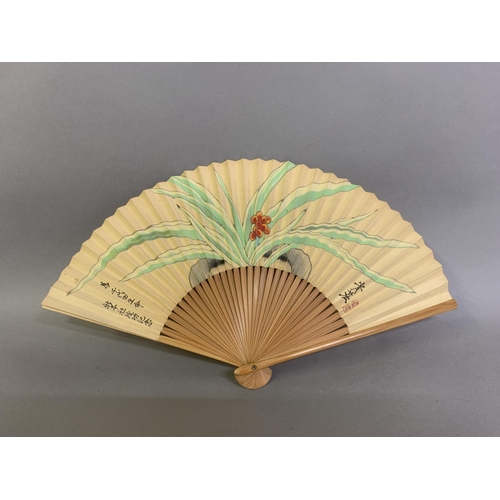 60 - A small 20th century celluloid brisé fan with a faint design of dancers, the lower guard printed wit... 