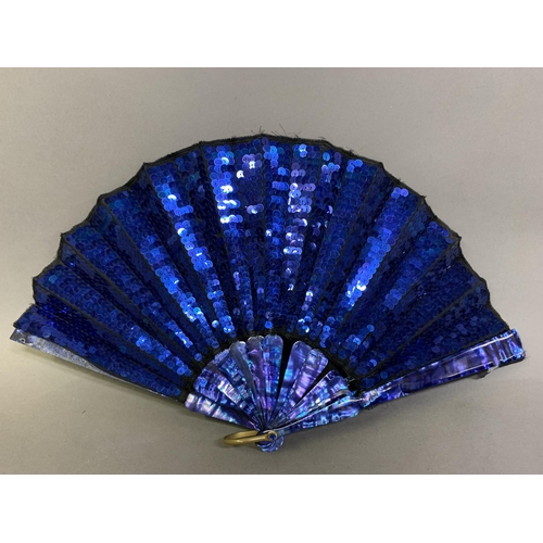 61 - An early 20th century opera fan, the leaf a panel of black gauze covered with bright blue sequins, w... 